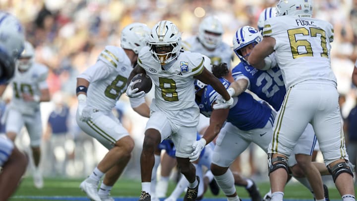 Dec 27, 2025; Orlando, FL, USA; Georgia Tech Yellow Jackets wide receiver Malik Rutherford (8) runs with the ball against the BYU Cougars in the first quarter during the Pop-Tarts Bowl at Camping World Stadium. Mandatory Credit: Nathan Ray Seebeck-Imagn Images