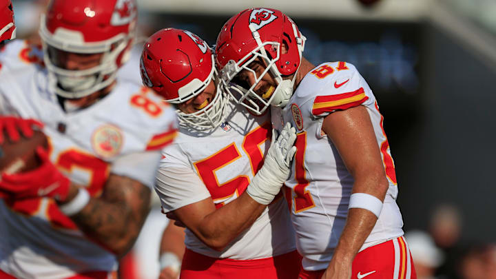 Kansas City Chiefs defensive end George Karlaftis (56) hugs tight end Travis Kelce (87) before a preseason NFL football game Saturday, Aug. 10, 2024 at EverBank Stadium in Jacksonville, Fla. [Corey Perrine/Florida Times-Union]