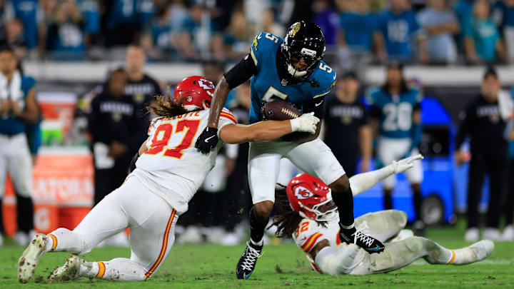 Jacksonville Jaguars wide receiver Dyami Brown (5) rushes for yards against Kansas City Chiefs defensive end Ashton Gillotte (97) and linebacker Nick Bolton (32) during the fourth quarter of an NFL football matchup at EverBank Stadium, Monday, Oct. 6, 2025, in Jacksonville, Fla. The Jacksonville Jaguars edged the Kansas City Chiefs 31-28. [Corey Perrine/Florida Times-Union]