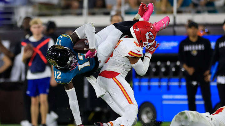 Jacksonville Jaguars wide receiver Travis Hunter (12) hauls in a reception against Kansas City Chiefs safety Bryan Cook (6) during the third quarter of an NFL football matchup at EverBank Stadium, Monday, Oct. 6, 2025, in Jacksonville, Fla. The Jacksonville Jaguars edged the Kansas City Chiefs 31-28. [Corey Perrine/Florida Times-Union]