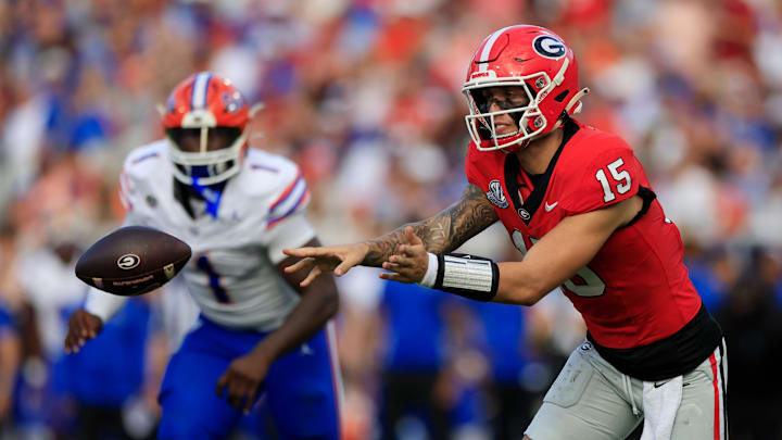 Georgia Bulldogs quarterback Carson Beck (15) pitches the ball during the second quarter of an NCAA college football matchup Saturday, Nov. 2, 2024 at EverBank Stadium in Jacksonville, Fla. The Georgia Bulldogs defeated the Florida Gators 34-20. [Corey Perrine/Florida Times-Union]