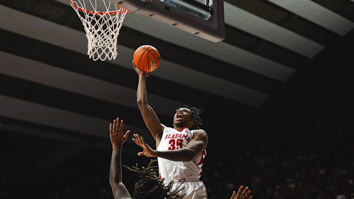 Dec 22, 2024; Tuscaloosa, Alabama, USA; Alabama Crimson Tide forward Derrion Reid (35) shoots for the basket against Kent State Golden Flashes forward VonCameron Davis (1) during the first half at Coleman Coliseum. Mandatory Credit: Will McLelland-Imagn Images