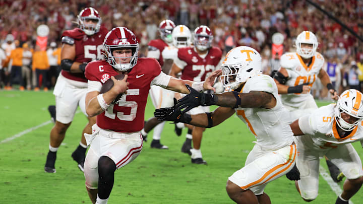 Oct 18, 2025; Tuscaloosa, Alabama, USA; Alabama Crimson Tide quarterback Ty Simpson (15) is forced out of bounds by Tennessee Volunteers linebacker Arion Carter (7) in he fourth quarter at Saban Field at Bryant-Denny Stadium.