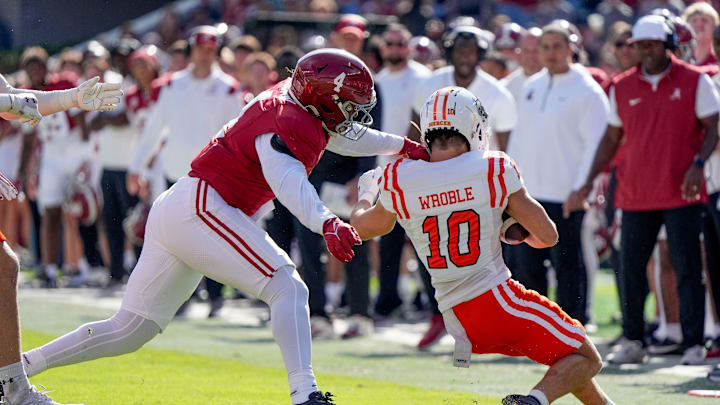 Nov 16, 2024; Tuscaloosa, AL, USA; Alabama Crimson Tide linebacker Qua Russaw (4) is called for a horse collar tackle on Mercer wide receiver Parker Wroble (10) at Bryant-Denny Stadium. Mandatory Credit: Gary Cosby Jr.-Tuscaloosa News