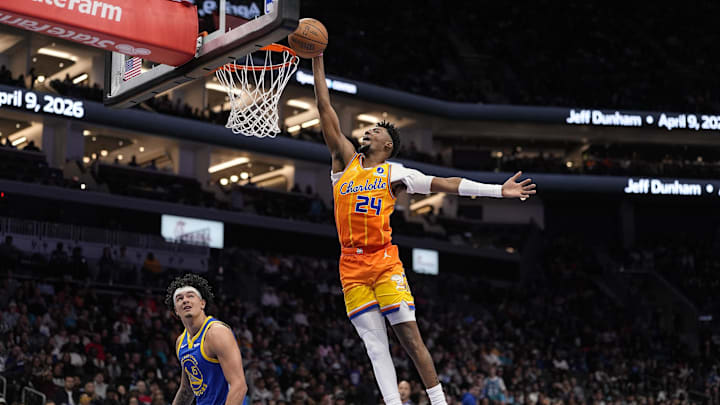 Dec 31, 2025; Charlotte, North Carolina, USA;  Charlotte Hornets forward Brandon Miller (24) with a slam dunk against the Golden State Warriors  during the second quarter at Spectrum Center. Mandatory Credit: Jim Dedmon-Imagn Images