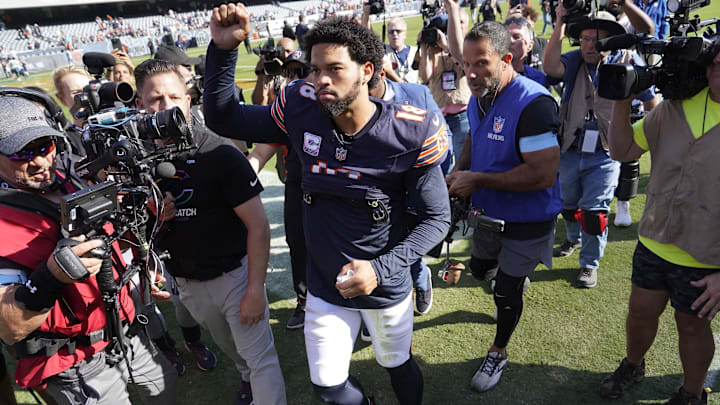 Caleb Williams gestures to the crowd as he leaves the field a winner for the third straight start at home Sunday.