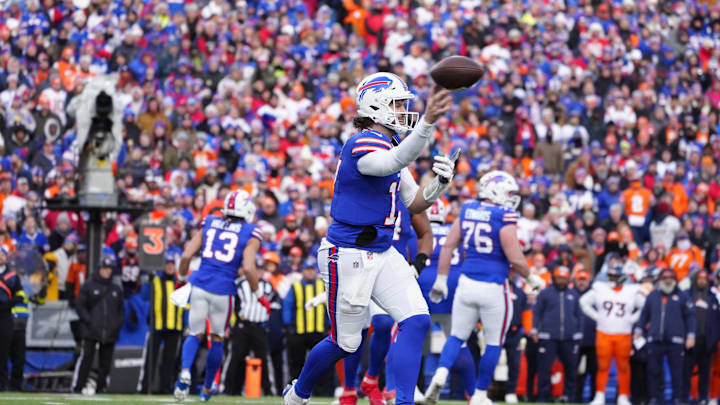 Buffalo Bills quarterback Josh Allen throws downfield during the fourth quarter against the Denver Broncos in an AFC wild card game at Highmark Stadium. Buffalo Bills quarterback Josh Allen throws downfield during the fourth quarter against the Denver Broncos in an AFC wild card game at Highmark Stadium.
