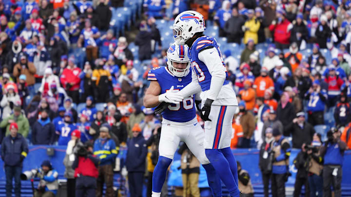 Jan 12, 2025; Orchard Park, New York, USA; Buffalo Bills linebacker Matt Milano (58) and defensive end Greg Rousseau (50) celebrate a sack during the fourth quarter against the Denver Broncos in an AFC wild card game at Highmark Stadium.