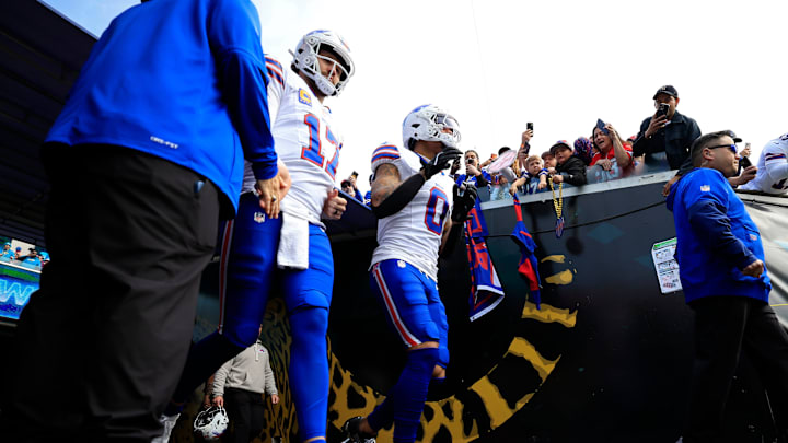 Buffalo Bills quarterback Josh Allen (17) and wide receiver Keon Coleman (0) run on the field before an NFL football AFC Wild Card playoff matchup, Sunday, Jan. 11, 2026, in Jacksonville, Fla.