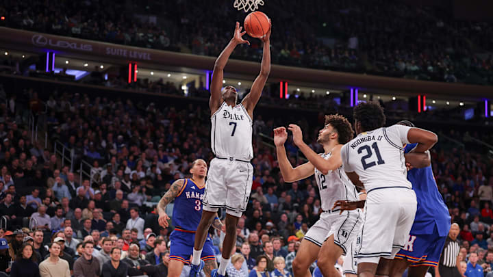 Nov 18, 2025; New York, New York, USA; Duke Blue Devils guard Dame Sarr (7) goes to the basket against the Kansas Jayhawks during the first half at Madison Square Garden. Mandatory Credit: Vincent Carchietta-Imagn Images