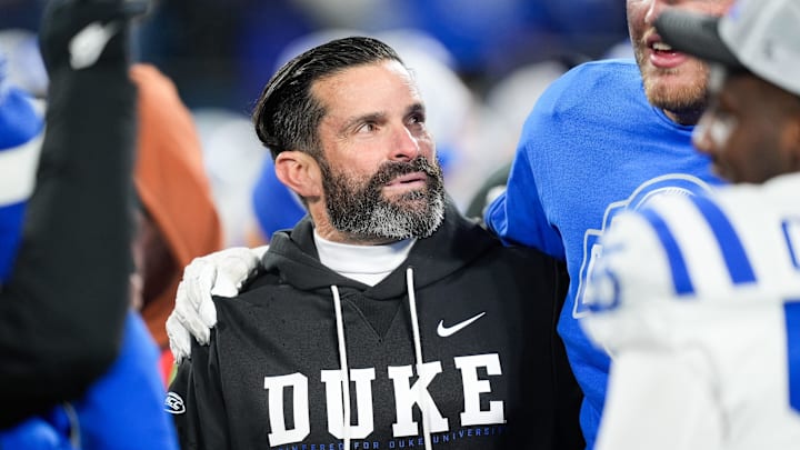 Dec 6, 2025; Charlotte, NC, USA; Duke Blue Devils head coach Manny Diaz looks on after the game against the Virginia Cavaliers during the 2025 ACC Championship game at Bank of America Stadium. Mandatory Credit: Jim Dedmon-Imagn Images Dec 6, 2025; Charlotte, NC, USA; Duke Blue Devils head coach Manny Diaz looks on after the game against the Virginia Cavaliers during the 2025 ACC Championship game at Bank of America Stadium. Mandatory Credit: Jim Dedmon-Imagn Images