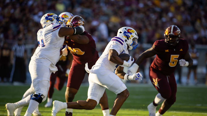 Oct 5, 2024; Tempe, Arizona, USA; Kansas Jayhawks running back Devin Neal (4) against the Arizona State Sun Devils at Mountain America Stadium. Mandatory Credit: Mark J. Rebilas-Imagn Images