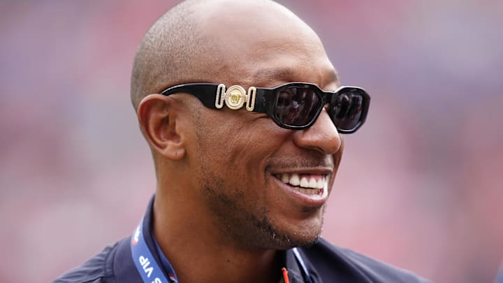 Oct 19, 2025; Denver, Colorado, USA; Retired NFL player Chris Harris looks on during the warmups between New York Giants and the Denver Broncos at Empower Field at Mile High. Mandatory Credit: Ron Chenoy-Imagn Images