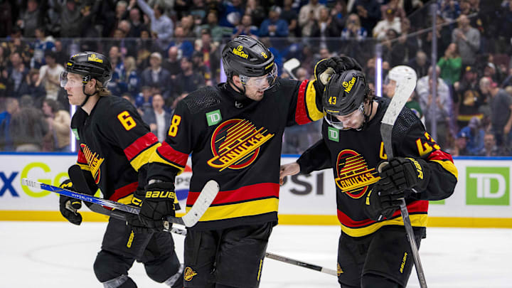Apr 10, 2024; Vancouver, British Columbia, CAN; Vancouver Canucks forward Brock Boeser (6) and forward Conor Garland (8) and defenseman Quinn Hughes (43) celebrate a goal scored by forward Elias Pettersson (40) against the Arizona Coyotes in the third period at Rogers Arena. Arizona won 4-3 in overtime. Mandatory Credit: Bob Frid-Imagn Images Apr 10, 2024; Vancouver, British Columbia, CAN; Vancouver Canucks forward Brock Boeser (6) and forward Conor Garland (8) and defenseman Quinn Hughes (43) celebrate a goal scored by forward Elias Pettersson (40) against the Arizona Coyotes in the third period at Rogers Arena. Arizona won 4-3 in overtime. Mandatory Credit: Bob Frid-Imagn Images