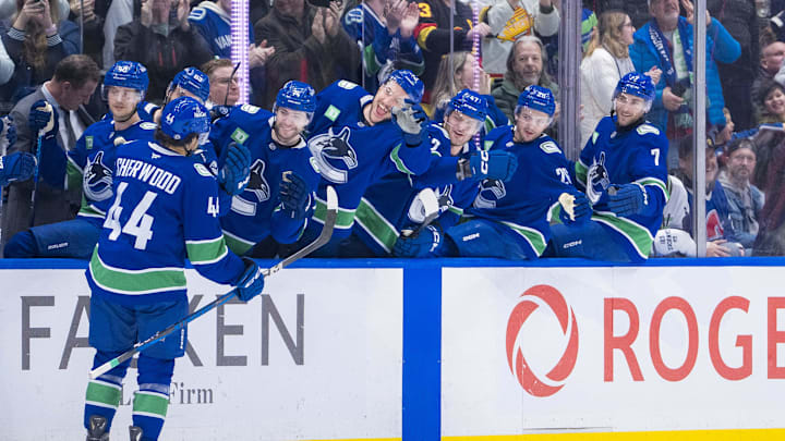 Dec 16, 2024; Vancouver, British Columbia, CAN; Vancouver Canucks forward Kiefer Sherwood (44) celebrates his third goal of the game with the bench against the Colorado Avalanche during the third period at Rogers Arena. Mandatory Credit: Bob Frid-Imagn Images