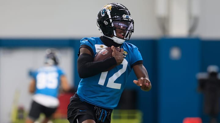 Jacksonville Jaguars wide receiver Travis Hunter (12) runs the ball during the 10th organized team activity at Miller Electric Center Wednesday, June 4, 2025 in Jacksonville, Fla. [Corey Perrine/Florida Times-Union]