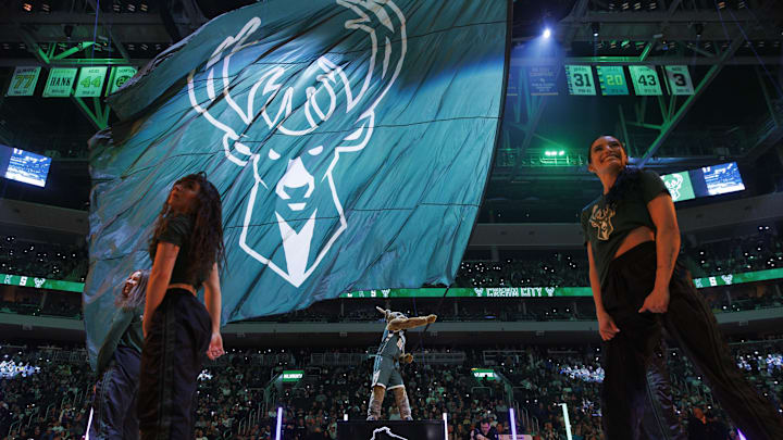 Feb 8, 2024; Milwaukee, Wisconsin, USA;  Milwaukee Bucks mascot Bango waves a flag with the Milwaukee Bucks logo prior to the game against the Minnesota Timberwolves at Fiserv Forum. Mandatory Credit: Jeff Hanisch-Imagn Images