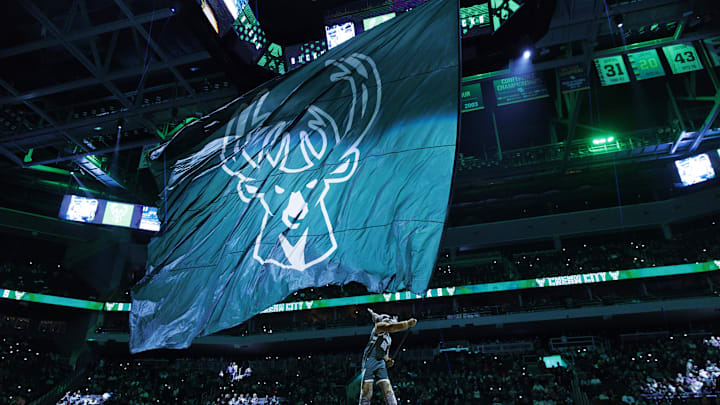 Dec 11, 2023; Milwaukee, Wisconsin, USA: Milwaukee Bucks mascot Bango waves flag with the Milwaukee Bucks logo prior to the game against the Chicago Bulls at Fiserv Forum. Mandatory Credit: Jeff Hanisch-Imagn Images