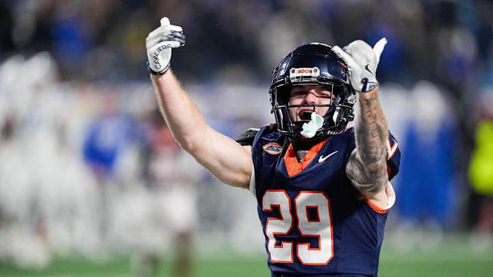 Dec 6, 2025; Charlotte, NC, USA; Virginia Cavaliers running back Davis Lane Jr. (29) celebrates going into overtime against the Duke Blue Devils during the 2025 ACC Championship game at Bank of America Stadium. Mandatory Credit: Jim Dedmon-Imagn Images