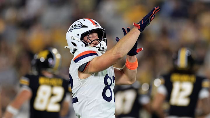 Virginia Cavaliers wide receiver Eli Wood (82) reacts to his defensive stop during the third quarter of the TaxSlayer Gator Bowl at EverBank Stadium, Saturday, Dec. 27, 2025, in Jacksonville. Fla. Virginia defeated the Missouri 13-7. [Corey Perrine/Florida Times-Union]