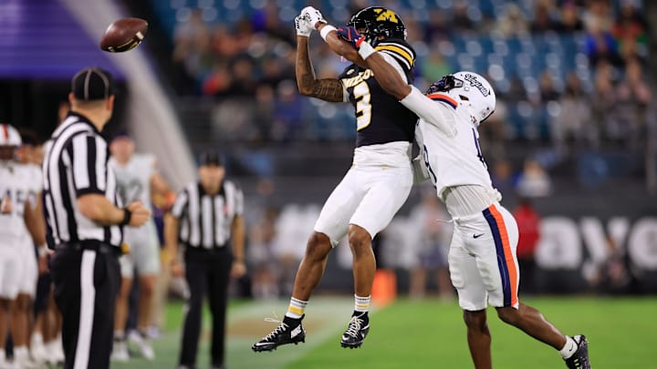 Missouri Tigers wide receiver Kevin Coleman Jr. (3) can’t haul in a reception as Virginia Cavaliers cornerback Emmanuel Karnley (19) defends during the third quarter of the TaxSlayer Gator Bowl at EverBank Stadium, Saturday, Dec. 27, 2025, in Jacksonville. Fla. Virginia defeated the Missouri 13-7. [Corey Perrine/Florida Times-Union]