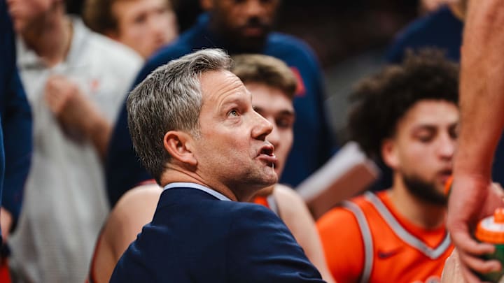 Feb 21, 2026; Charlottesville, Virginia, USA; Virginia Cavaliers head coach Ryan Odom speaks with his team during a timeout in the second half against the Miami (FL) Hurricanes at John Paul Jones Arena. Mandatory Credit: Emily Faith Morgan-Imagn Images Feb 21, 2026; Charlottesville, Virginia, USA; Virginia Cavaliers head coach Ryan Odom speaks with his team during a timeout in the second half against the Miami (FL) Hurricanes at John Paul Jones Arena. Mandatory Credit: Emily Faith Morgan-Imagn Images