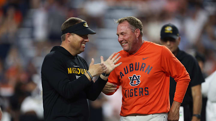Auburn, Alabama, USA; Missouri Tigers head coach Eli Drinkwitz and Auburn Tigers head coach Hugh Freeze speak before the game at Jordan-Hare Stadium.