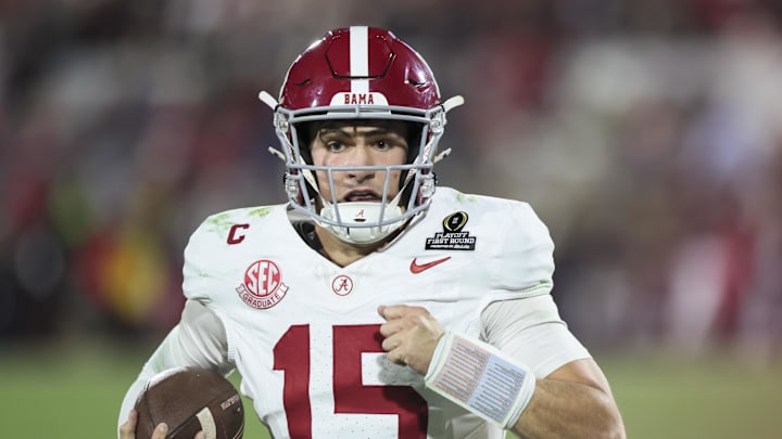 Dec 19, 2025; Norman, OK, USA; Alabama Crimson Tide quarterback Ty Simpson (15) runs the ball in the second half against the Oklahoma Sooners at Gaylord Family OK Memorial Stadium. Mandatory Credit: Nelson Chenault-Imagn Images