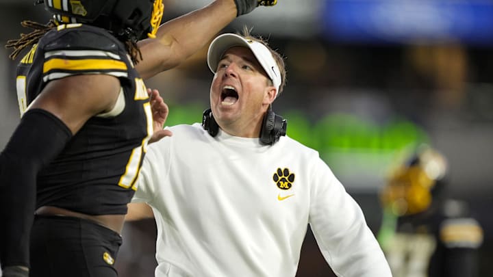 Columbia, Missouri, USA; Missouri Tigers head coach Eli Drinkwitz talks to safety Santana Banner (15) during the second half against the Texas A&M Aggies at Faurot Field at Memorial Stadium.