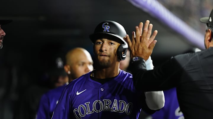 Jun 24, 2025; Denver, Colorado, USA; Colorado Rockies shortstop Ryan Ritter (8) celebrates scoring a run in the eighth inning inning against the Los Angeles Dodgers at Coors Field. Mandatory Credit: Ron Chenoy-Imagn Images
