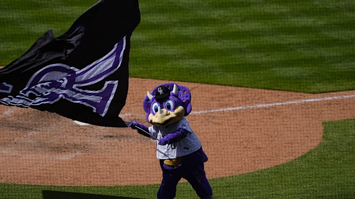 Jul 3, 2025; Denver, Colorado, USA; Colorado Rockies mascot Dinger celebrates defeating the Houston Astros at Coors Field. 