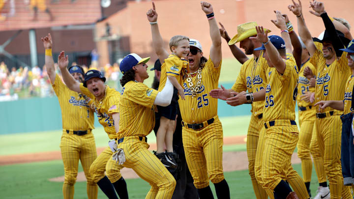 The Savanah Bananas celebrate after a young fan hit a home run during a baseball game between Savannah Bananas and the Party Animals at Chickasaw Bricktown Ballpark in Oklahoma City, Thursday, May, 16, 2024.