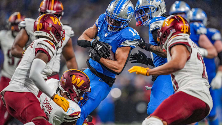 Detroit Lions wide receiver Amon-Ra St. Brown (14) catches the ball in traffic against Washington Commanders during the NFL game at Ford Field in Detroit, Mich, Saturday, Jan. 18, 2025.