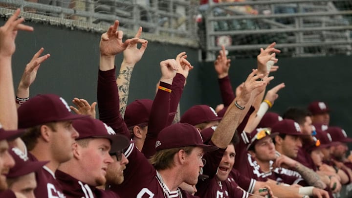 Mississippi State players celebrate a hit by a teammate at Sewell-Thomas Stadium in Tuscaloosa.