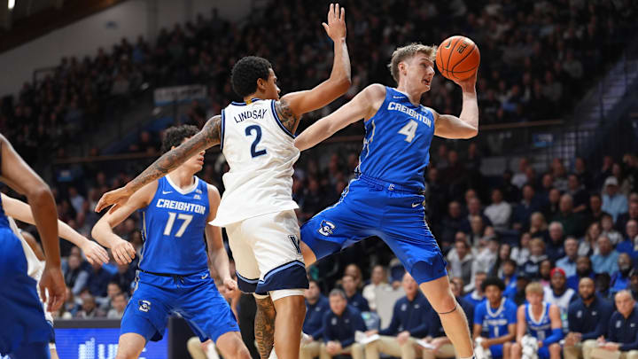Creighton Bluejays guard Josh Dix (4) and Villanova Wildcats guard Bryce Lindsay (2) battle for the ball in the first half at William B. Finneran Pavilion.