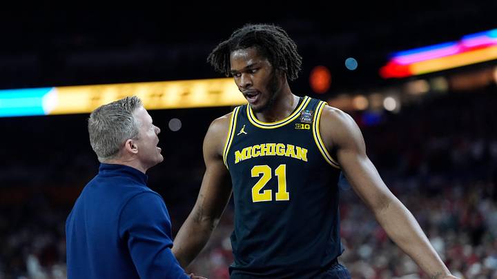 Michigan head coach Dusty May speaks with Michigan forward Morez Johnson Jr. (21) in the first half of their Final Four game against Arizona at Lucas Oil Stadium in Indianapolis on Saturday, April 4, 2026. Michigan head coach Dusty May speaks with Michigan forward Morez Johnson Jr. (21) in the first half of their Final Four game against Arizona at Lucas Oil Stadium in Indianapolis on Saturday, April 4, 2026.