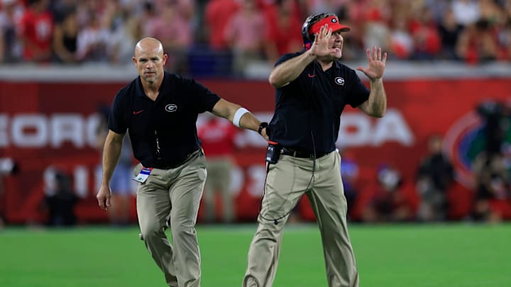 Georgia Bulldogs head coach Kirby Smart is held back by another personnel during the fourth quarter of an NCAA college football matchup Saturday, Nov. 2, 2024 at EverBank Stadium in Jacksonville, Fla. The Georgia Bulldogs defeated the Florida Gators 34-20. [Corey Perrine/Florida Times-Union]