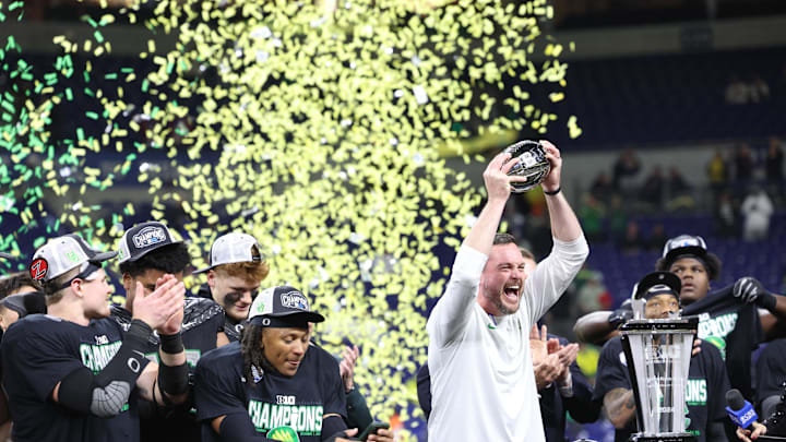 Dec 7, 2024; Indianapolis, IN, USA; Oregon Ducks head coach Dan Lanning and the Oregon Ducks celebrate defeating the Penn State Nittany Lions to win the Big Ten Championship in the 2024 Big Ten Championship game at Lucas Oil Stadium. Mandatory Credit: Jordan Prather-Imagn Images
