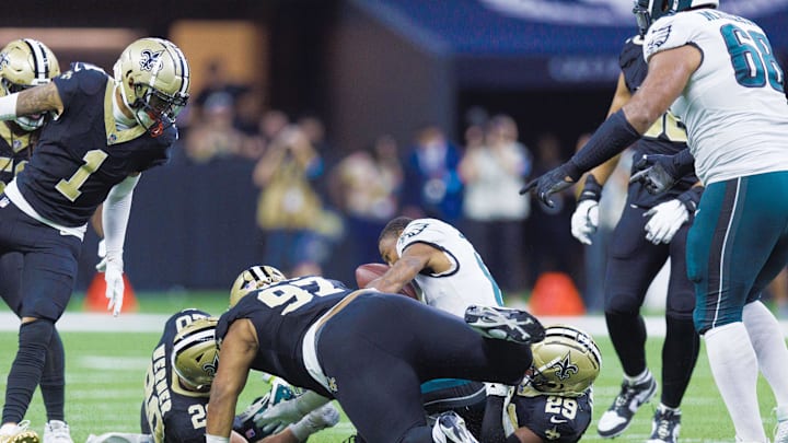 Philadelphia Eagles wide receiver DeVonta Smith (6) is injured on a tackle by New Orleans Saints defensive tackle Khristian Boyd (97) Philadelphia Eagles wide receiver DeVonta Smith (6) is injured on a tackle by New Orleans Saints defensive tackle Khristian Boyd (97)