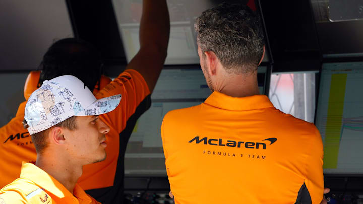 May 4, 2024; Miami Gardens, Florida, USA; McLaren driver Lando Norris (4) talks with crew members after the F1 Sprint Race at Miami International Autodrome. Mandatory Credit: John David Mercer-Imagn Images