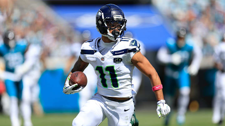 Seattle Seahawks wide receiver Jaxon Smith-Njigba (11) rushes for yards during the second quarter of an NFL football matchup, Sunday, Oct. 12, 2025, at EverBank Stadium in Jacksonville, Fla. The Seahawks defeated the Jaguars 20-12.