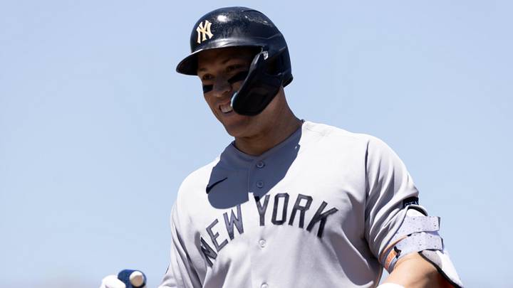 New York Yankees right fielder Aaron Judge (99) smiles back at his teammates after his bloop hit fell between two Athletics fielders during the third inning at Sutter Health Park. Mandatory Credit: D. Ross Cameron-Imagn Images