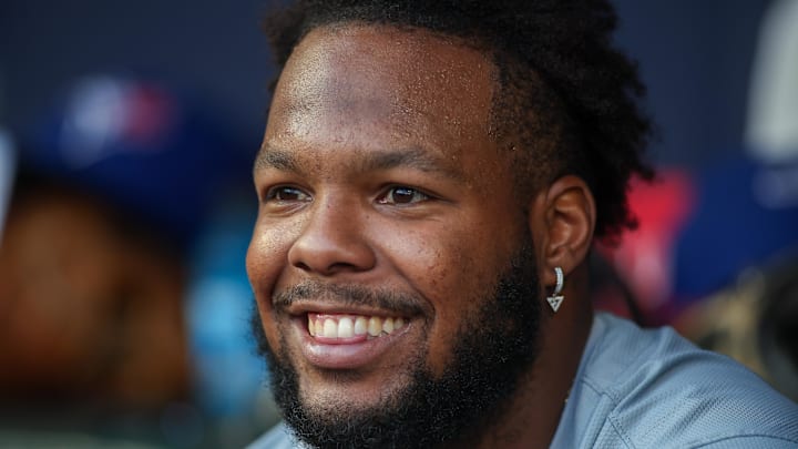 Toronto Blue Jays designated hitter Vladimir Guerrero Jr. (27) in the dugout against the Atlanta Braves in the first inning at Truist Park in 2024. Toronto Blue Jays designated hitter Vladimir Guerrero Jr. (27) in the dugout against the Atlanta Braves in the first inning at Truist Park in 2024.