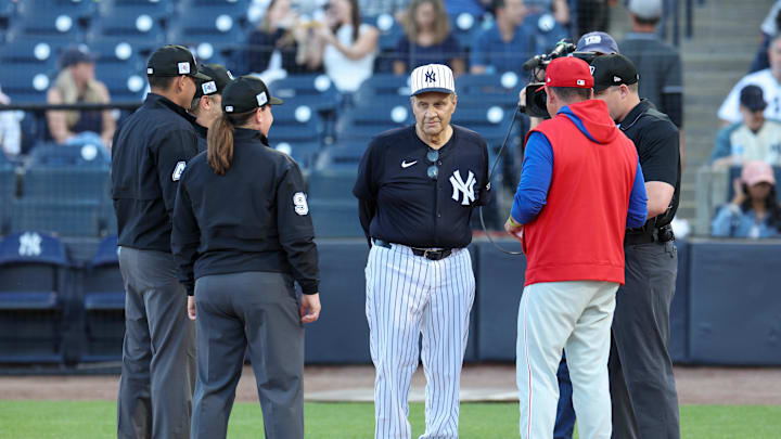 Former New York Yankees manager Joe Torre presents the lineup card to Philadelphia Phillies manager Rob Thomson (59) before a spring training game at George M. Steinbrenner Field on March 14.