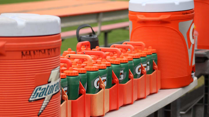 Gatorade sports drink coolers and bottles are lined up along the Mandarin High School bench during a high school football game against Creekside in Jacksonville, Florida, on September 23, 2022. [Clayton Freeman/Florida Times-Union]

092322 Gatorade Football Stock
