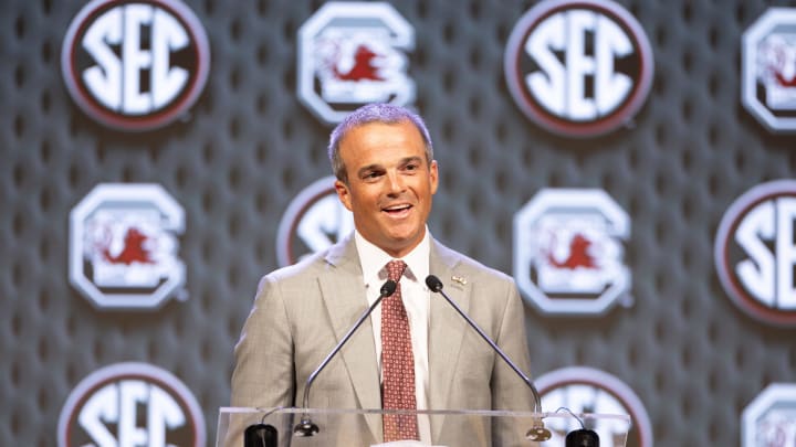 Jul 15, 2024; Dallas, TX, USA; South Carolina head coach Shane Beamer speaking to the media at Omni Dallas Hotel. Mandatory Credit: Brett Patzke-USA TODAY Sports Jul 15, 2024; Dallas, TX, USA; South Carolina head coach Shane Beamer speaking to the media at Omni Dallas Hotel. Mandatory Credit: Brett Patzke-USA TODAY Sports