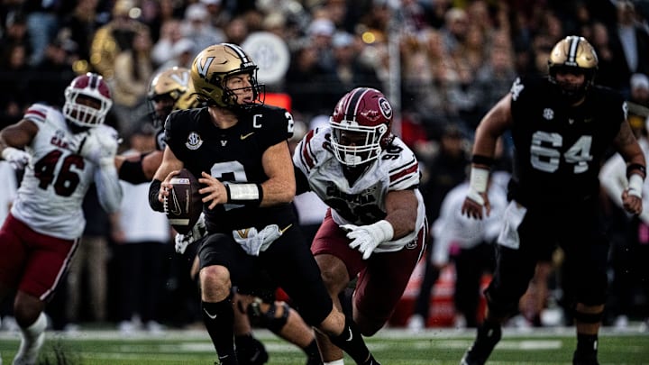 Vanderbilt Commodores quarterback Diego Pavia (2) looks to pass as South Carolina Gamecocks defensive tackle T.J. Sanders (90) goes to tackle during the first half at FirstBank Stadium in Nashville, Tenn., Saturday, Nov. 9, 2024. Vanderbilt Commodores quarterback Diego Pavia (2) looks to pass as South Carolina Gamecocks defensive tackle T.J. Sanders (90) goes to tackle during the first half at FirstBank Stadium in Nashville, Tenn., Saturday, Nov. 9, 2024.