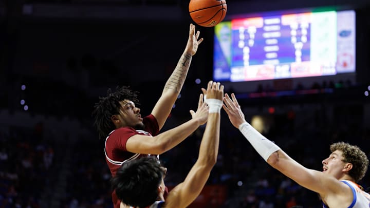 Feb 17, 2026; Gainesville, Florida, USA; South Carolina Gamecocks forward EJ Walker (6) shoots the ball over Florida Gators guard Xaivian Lee (1) and Florida Gators center Micah Handlogten (3) during the first half at Exactech Arena at the Stephen C. O'Connell Center. Mandatory Credit: Matt Pendleton-Imagn Images