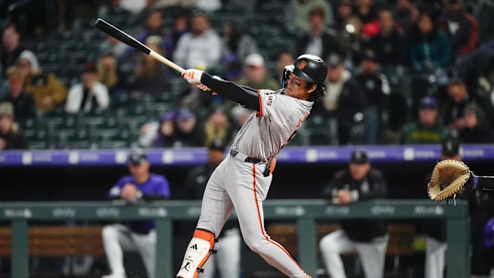 May 8, 2024; Denver, Colorado, USA; San Francisco Giants outfielder Jung Hoo Lee (51) swings the batt in the eighth inning against the Colorado Rockies at Coors Field. 