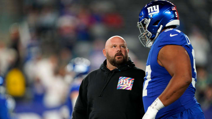 New York Giants head coach Brian Daboll, left, and defensive tackle Dexter Lawrence II (97) talk before the Giants take on the Seattle Seahawks at MetLife Stadium on Monday, Oct. 2, 2023, in East Rutherford.